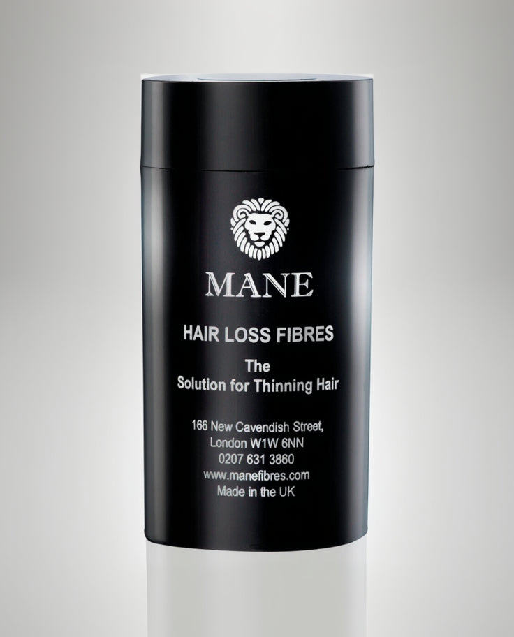 Black container of Mane hair loss fibres with branding and contact information.